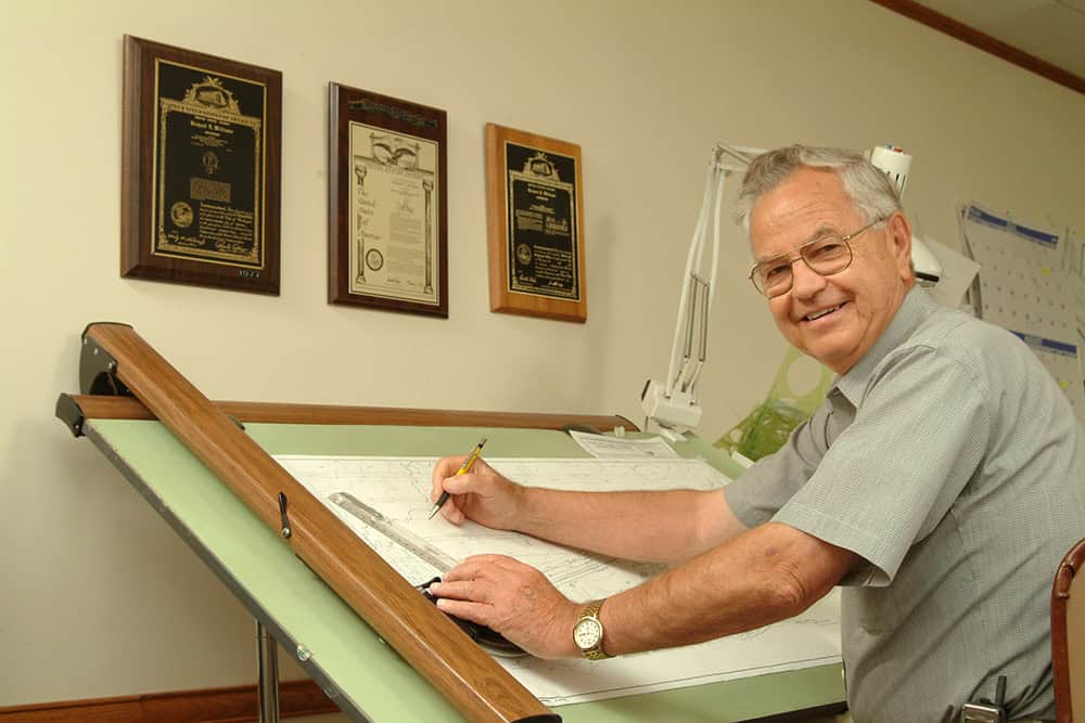 Dick Williams at his drawing table