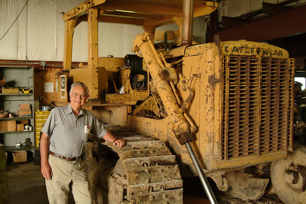 Dick Williams standing next to equipment